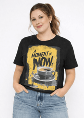 Woman wearing a black t-shirt with a graphic design and blue jeans on a white background