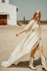Peacock Feather Maxi Wrap Dress W/ Train in Cream + Gold | Boutique In USA, Dresses, $ 425.00, A Moment Of Now™