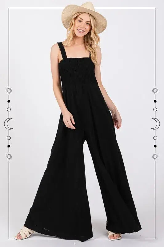 Black Smocked Flowy Wide Leg Jumpsuit, Jumpsuits, $ 49.00, A Moment Of Now™
